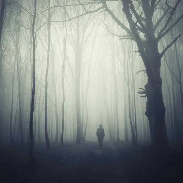 Man walking through fog of doubt